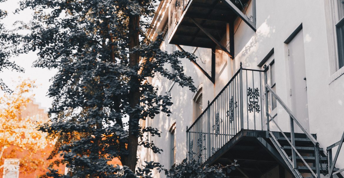 black metal staircase at the back of the house